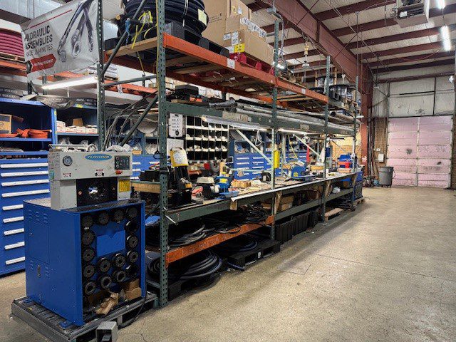 Industrial printing press in a large warehouse setting.